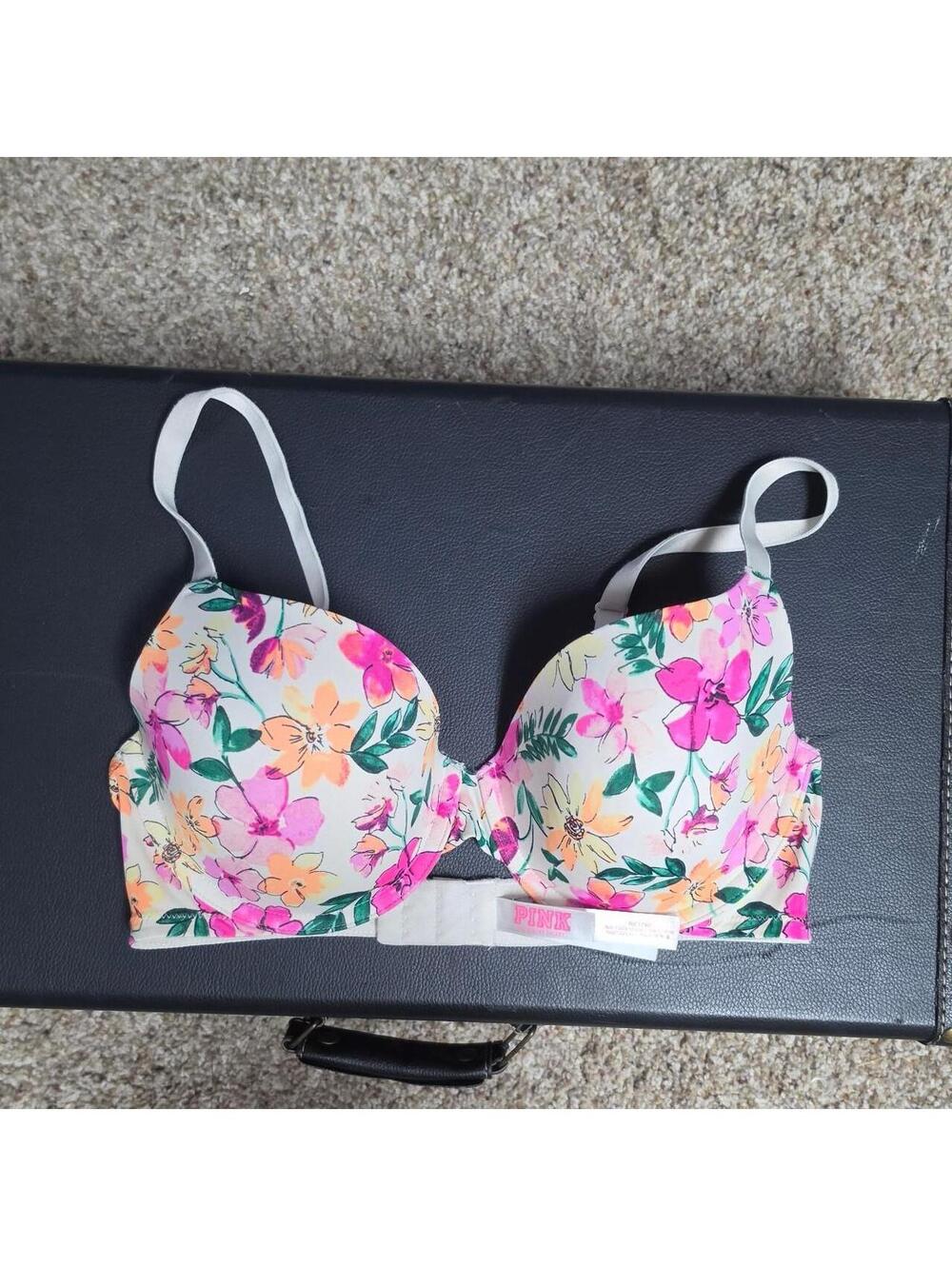 Victoria's Secret PINK floral bra with pink, orange, and green flowers